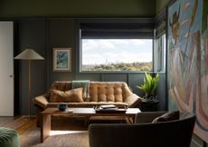 dark green living room with slim wooden paneling