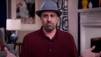 Gino Palazzolo on 90 Day Fianc&eacute; wearing a maroon shirt and a fedora