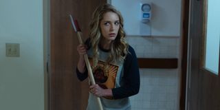 Jessica Rothe holding axe in Happy Death Day 2U