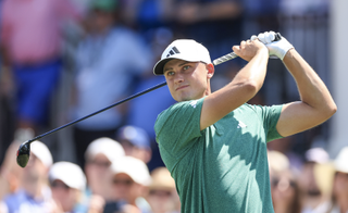 Ludvig Aberg hits a fairway wood shot