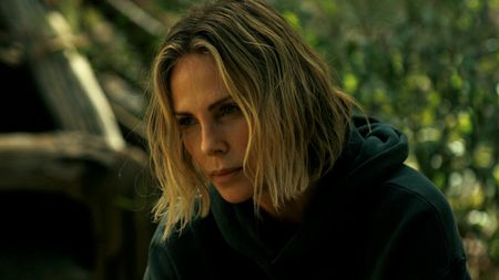 A close up of Charlize Theron in Apex