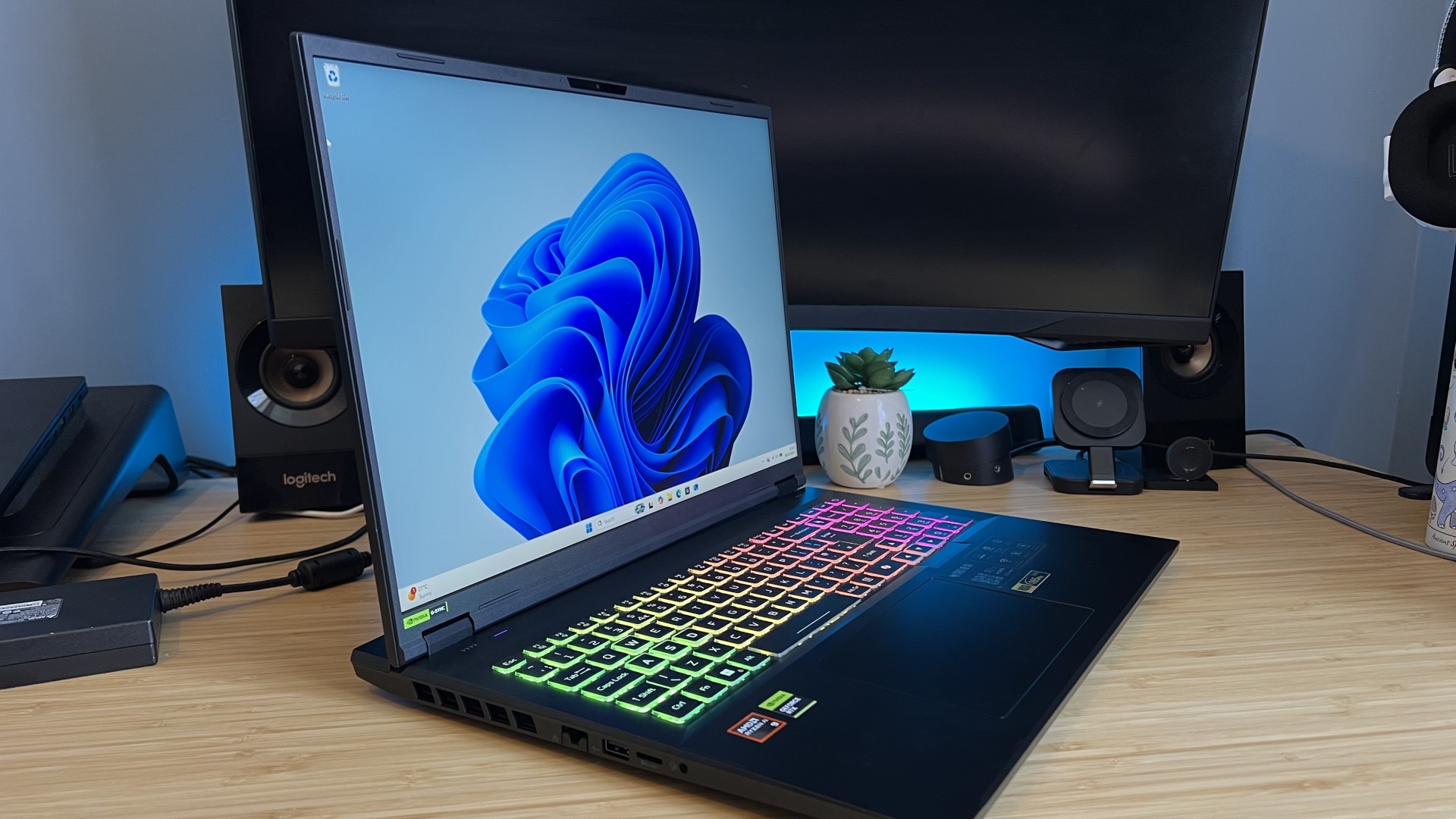 Acer Nitro 18 AI gaming laptop angled towards the camera on a wooden desk