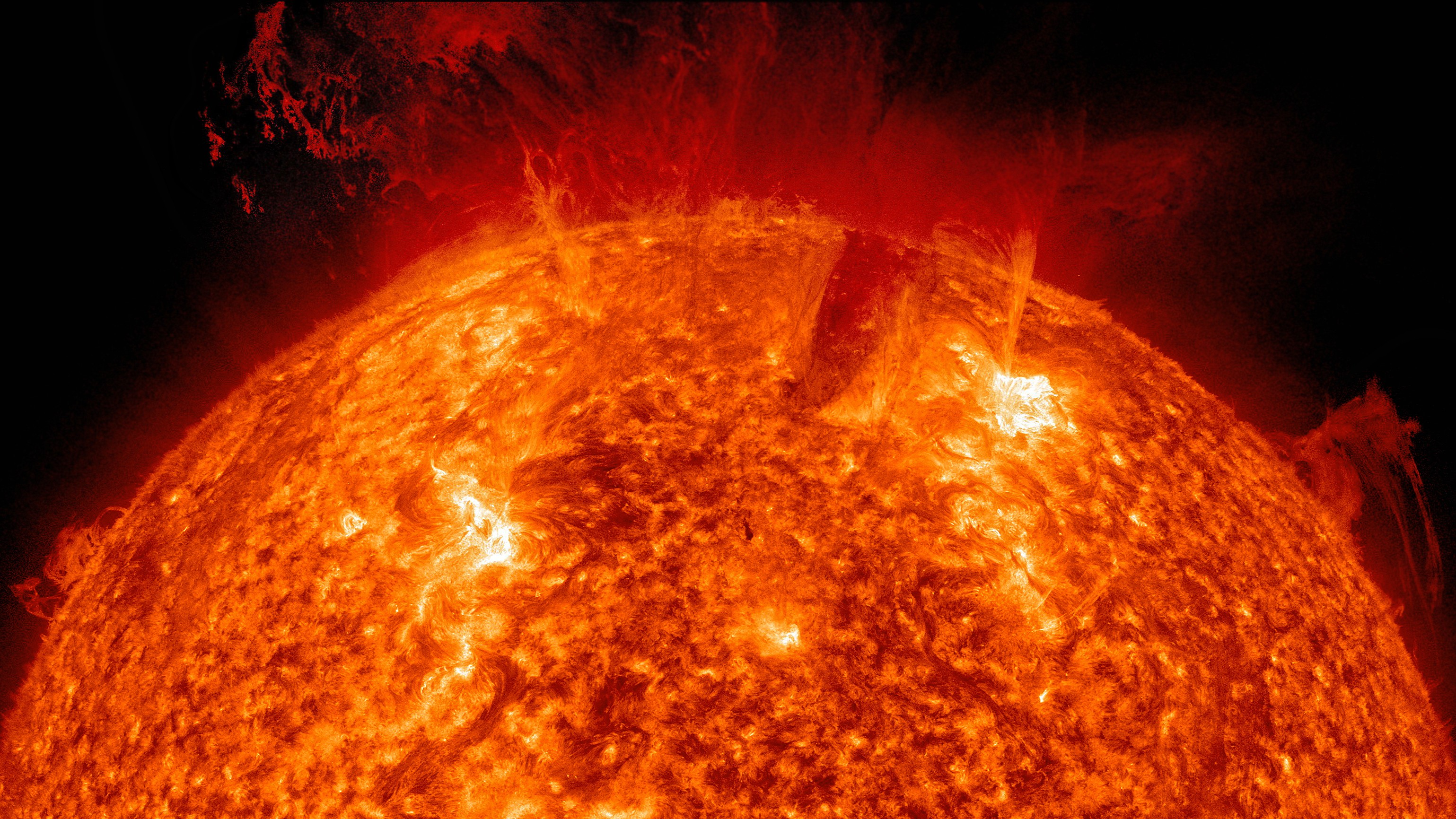 The eruption and evolution of a gigantic solar prominence from the surface of the sun, appears to tear off from the sun in a fiery eruption.