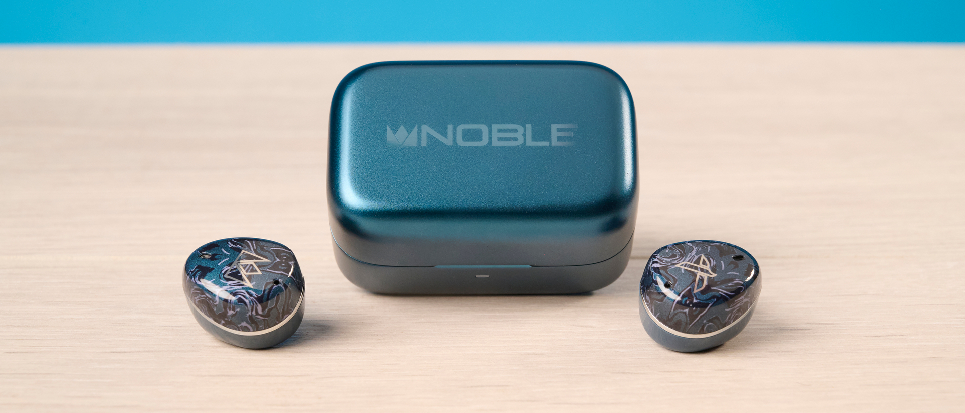 A pair of Noble Audio Osprey wireless earbuds