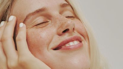 Woman wearing lip balm smiling