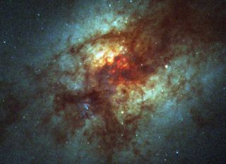 Astronomers have detected hydrogen cyanide and methanimine, two carbon compounds that can combine with water to make the amino acid glycine, in the Arp 220 galaxy.