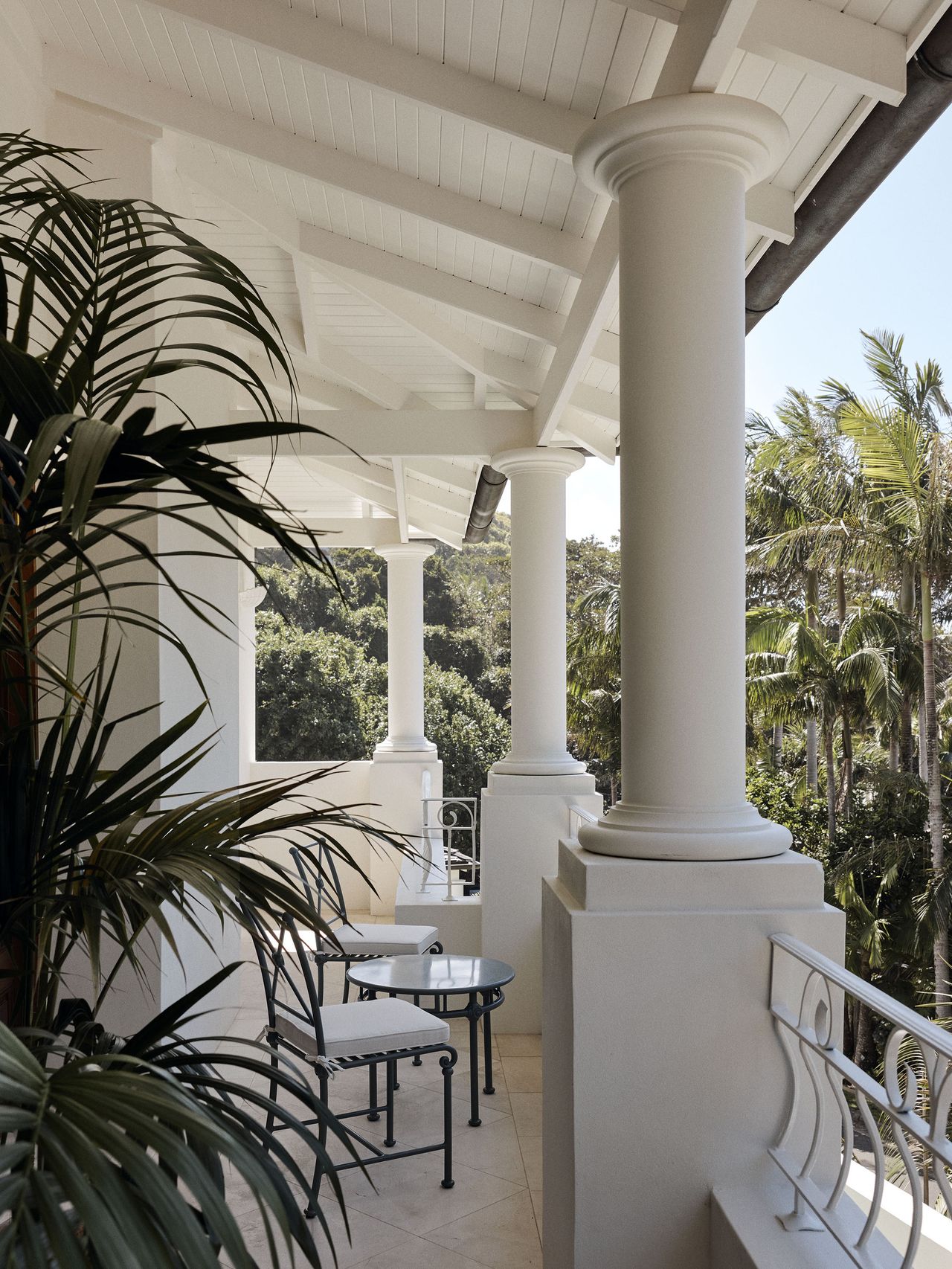 The balcony exterior of Raes Guesthouses Spanish design building with white columns