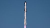 closeup of a huge silver rocket flying through a blue sky