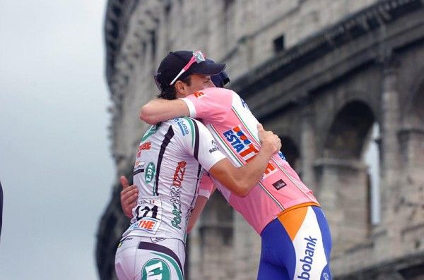 Giro rivals Danilo Di Luca and Denis Menchov embrace on the final podium.