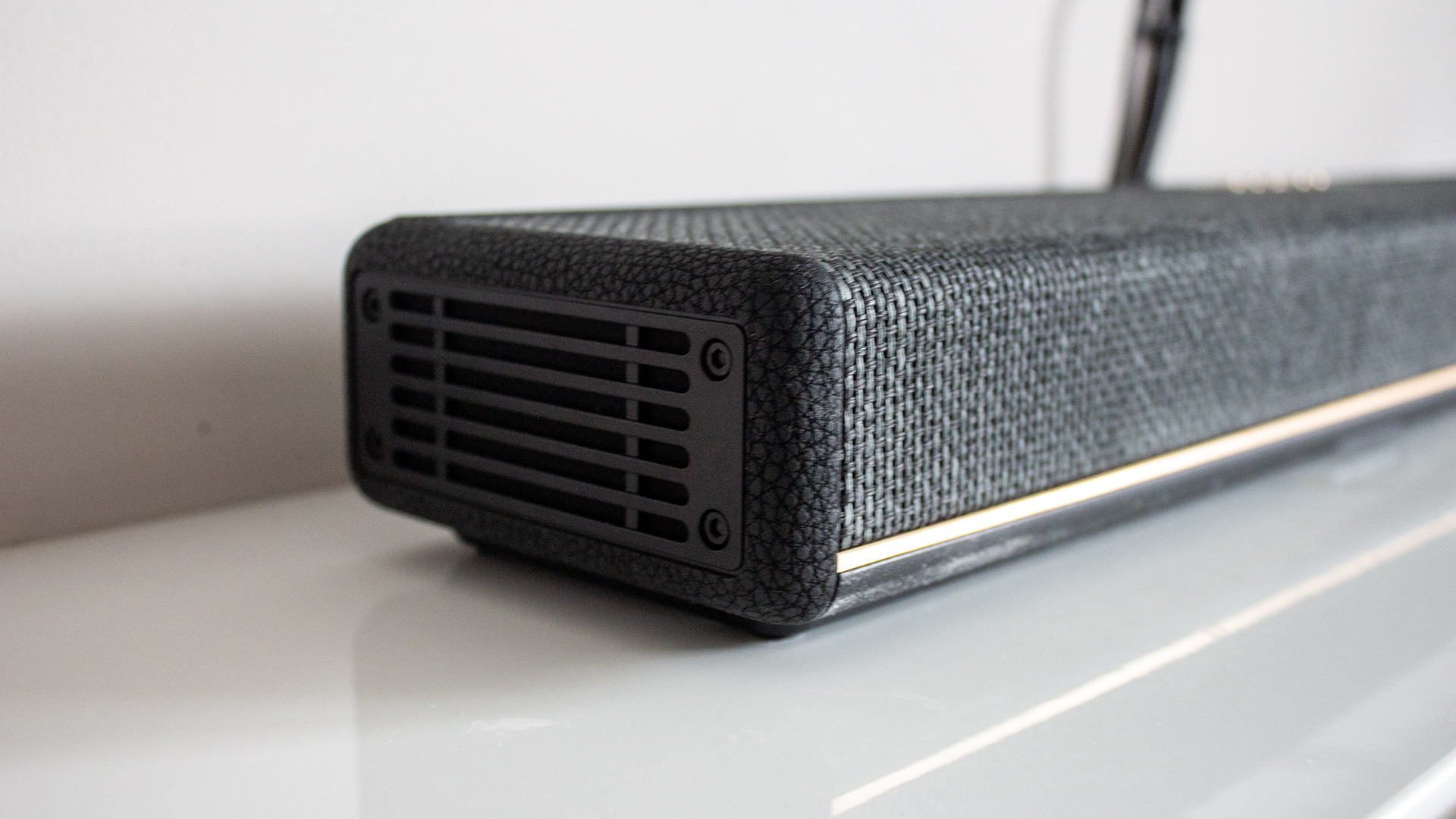 an image of marshall's heston 60 soundbar in a simple white room