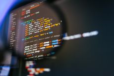 PyPI: Program code on computer display in magnifying glass