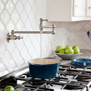 Kitchen stove and pot filler