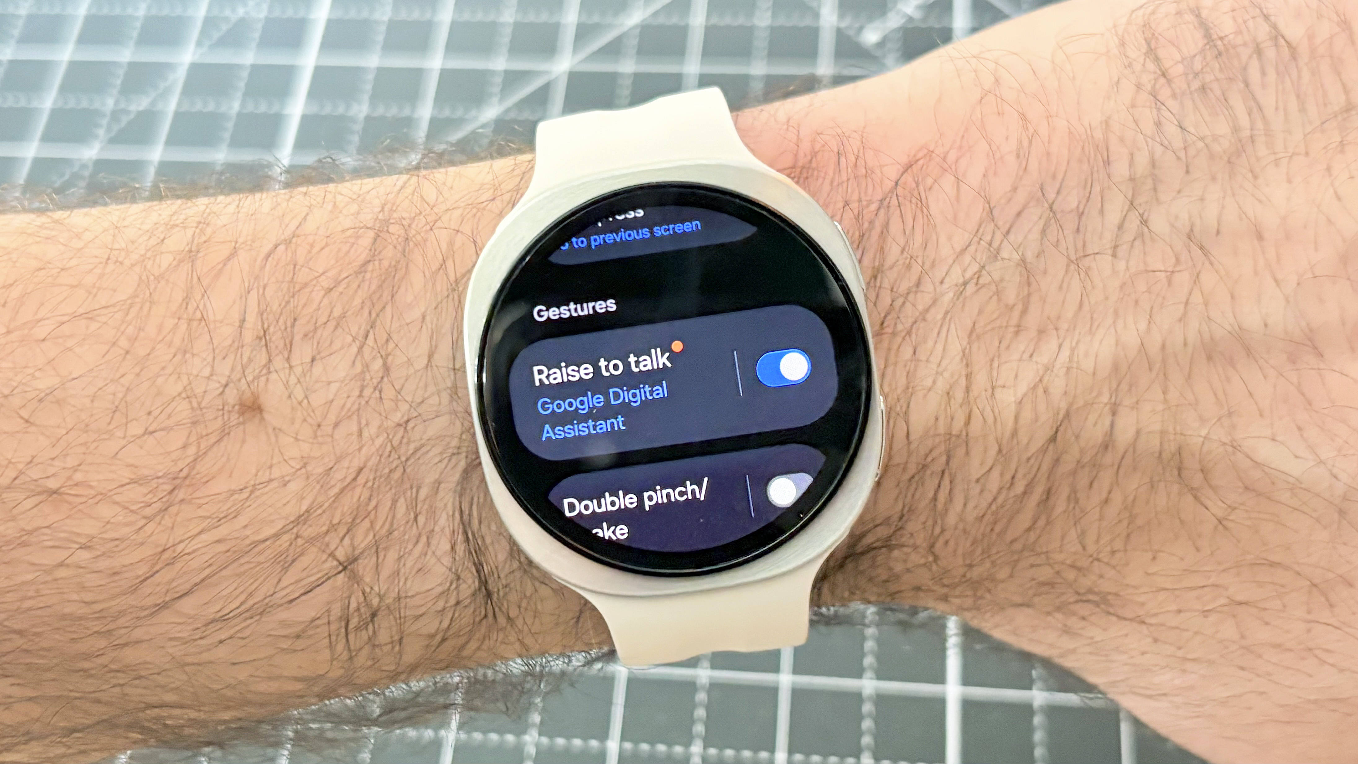 Close-up of the Samsung Galaxy Watch 9 on a user's wrist showing the gesture control options