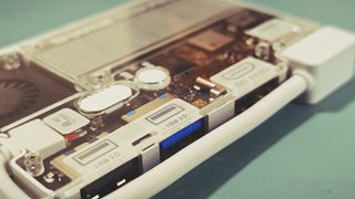 A Sharge Disk Pro SSD and USB dock on a green table