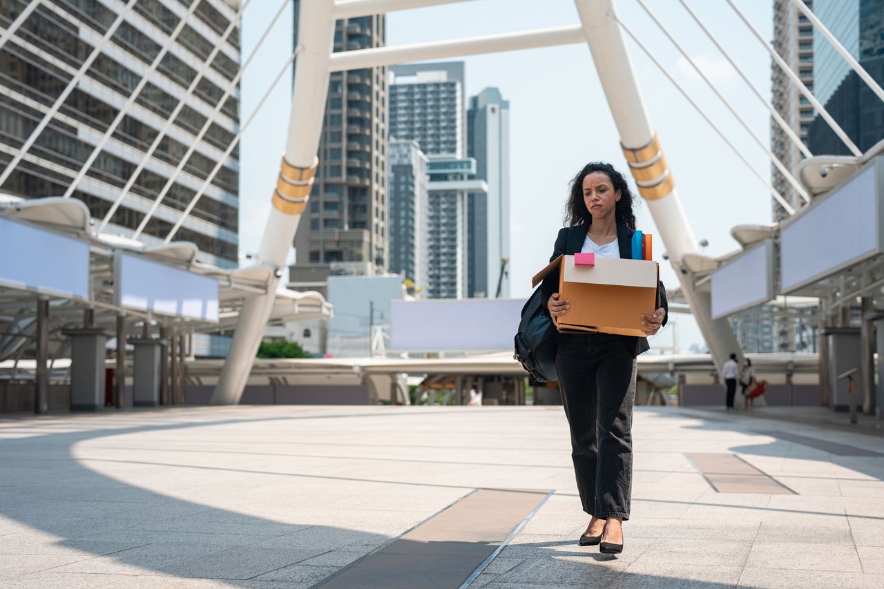 Woman carrying a box.