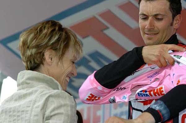 Ivan Basso has a little trouble getting into that maglia rosa, which must surely feel like his alone by now