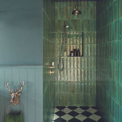 Bathroom with green wall tiles and checkerboard floors