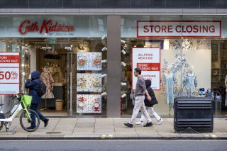 The front of a Cath Kidston store with a sign saying 'Store closing' in the window