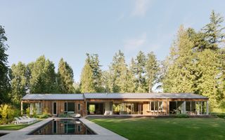 Interurban Residence, a low timber home with minimalist style and light wood tones