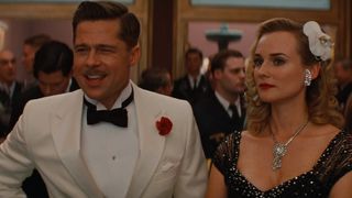 Brad Pitt, dressed in a white tuxedo next to Diane Kruger, in Inglourious Basterds