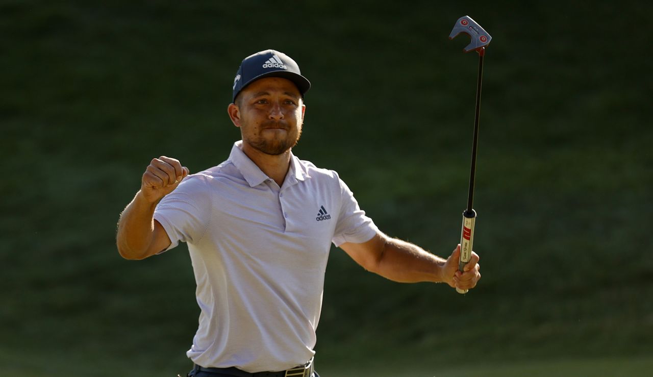 Schaufelle celebrates his putt at the 18th hole