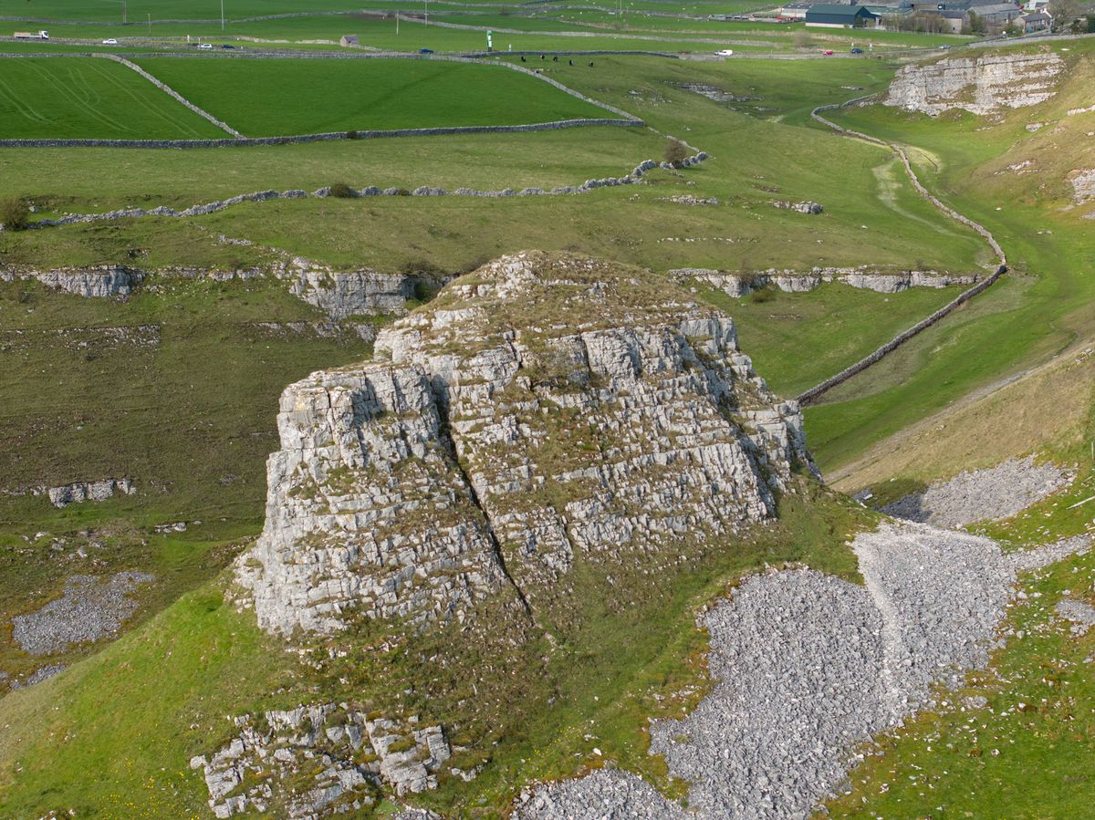 Photo taken by the DJI Mavic 3 Pro drone. Focal Length comparison at 70 mm. Here we see a wide angle shot of the side of a hill closer up.