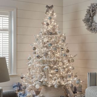 White Christmas tree with white and blue baubles