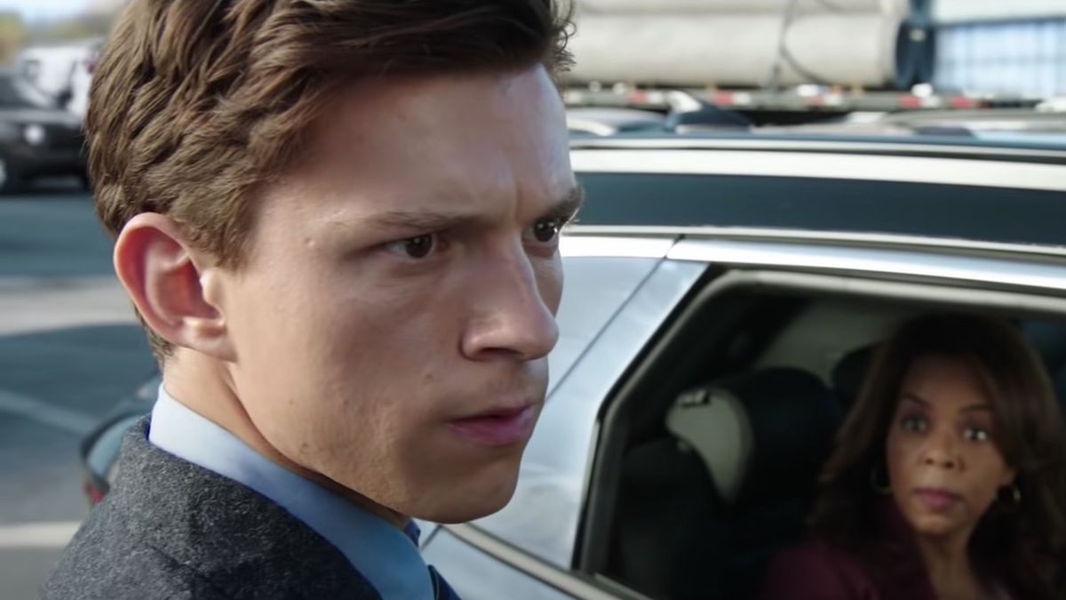 Tom Holland as Peter Parker staring at destruction in Spider-Man: No Way Home