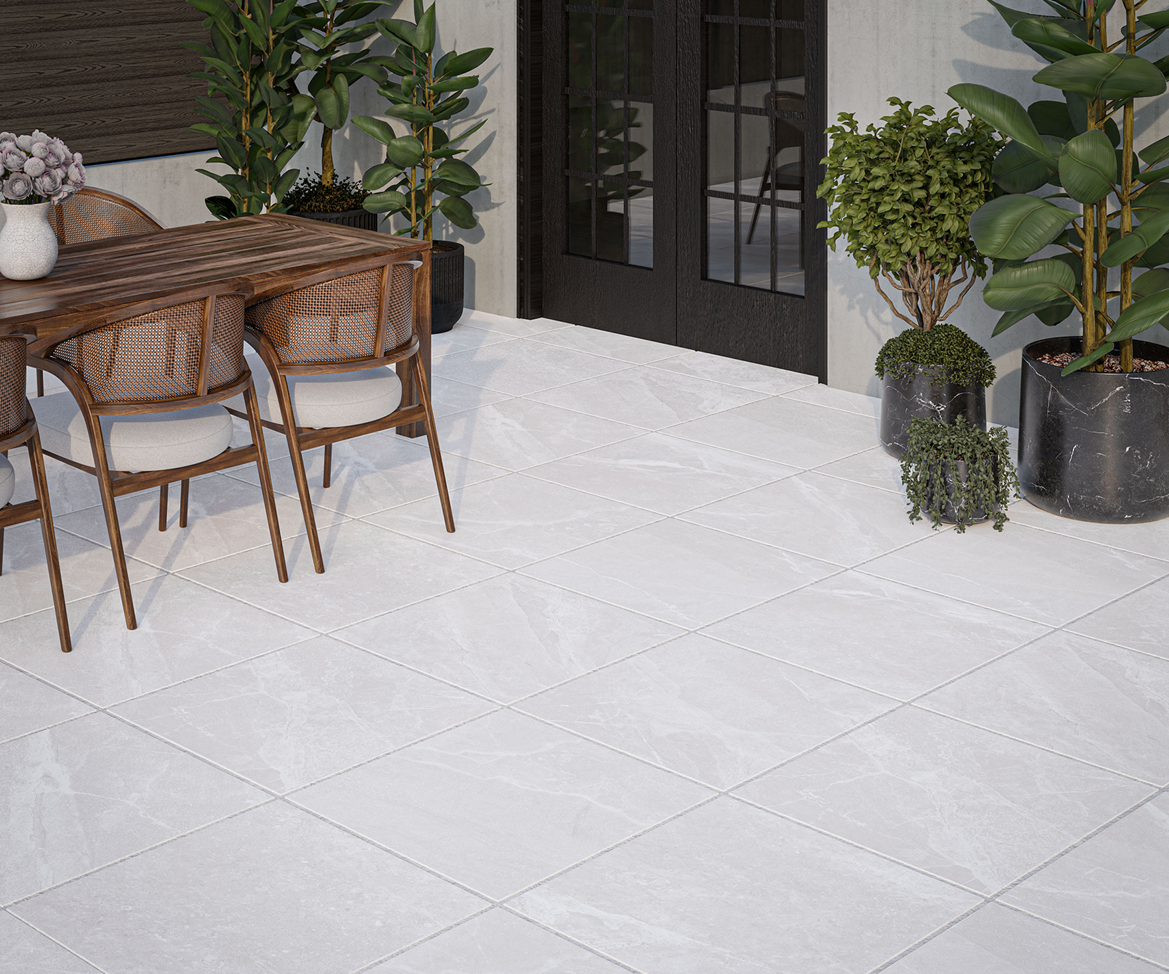 patio with porcelain pavers, garden furniture dining set, plants in containers, and patio doors