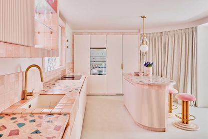 an all pink kitchen with terrazza countertops