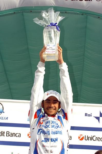 Jose Serpa (Androni Giocattoli) shows off his trophy for winning stage two.