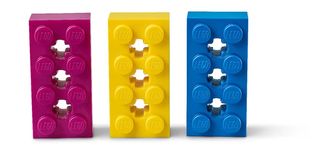 Three Lego bricks: purple, yellow and blue