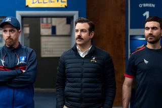 Brendan Hunt as Coach Beard, Jason Sudeikis as Ted and Brett Goldstein as Roy in Ted Lasso
