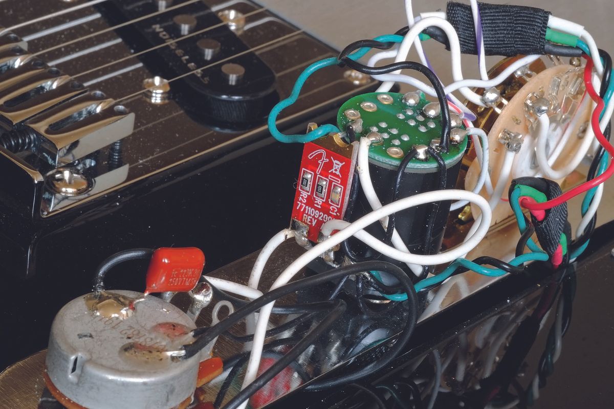 The Tele uses just two poles of its S-1 switch to achieve the series parallel link. The master tone is a no-load type