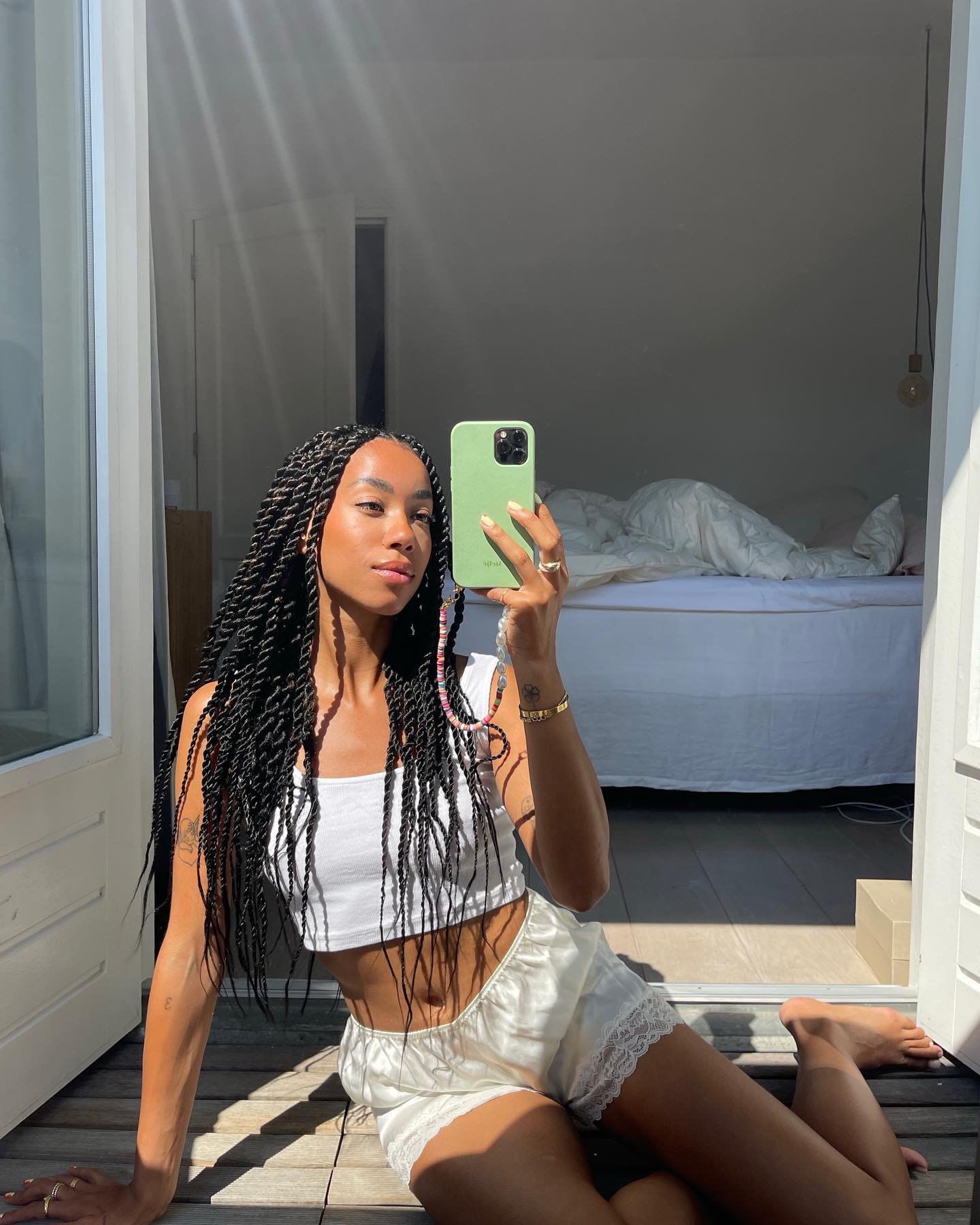 Influencer wears satin shorts.