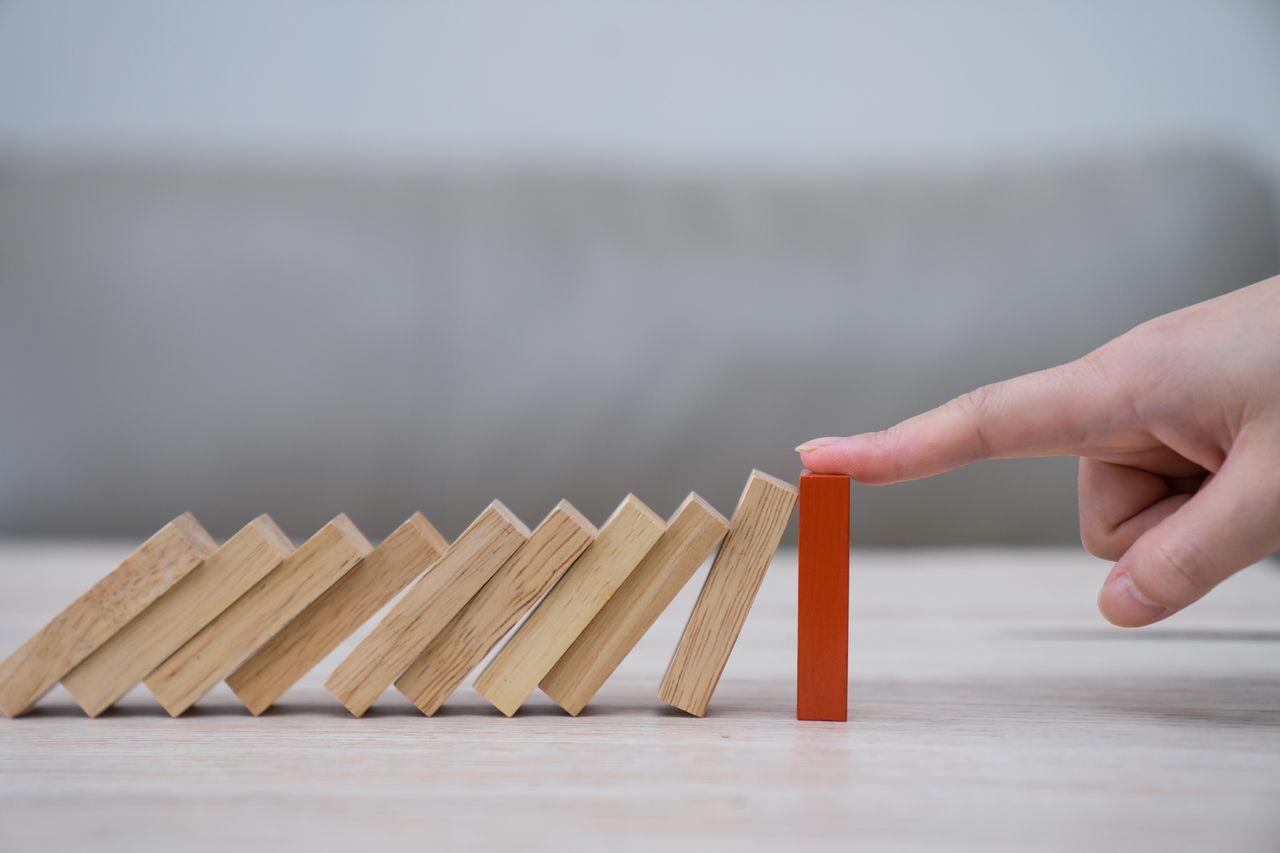 Domino,Wooden block,Business risk, strategy and planning concept idea