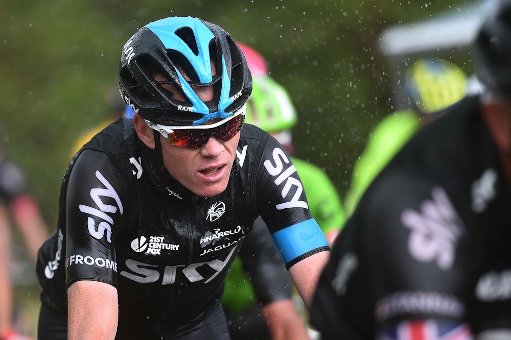 Chris Froome rides in the rain during stage 4.