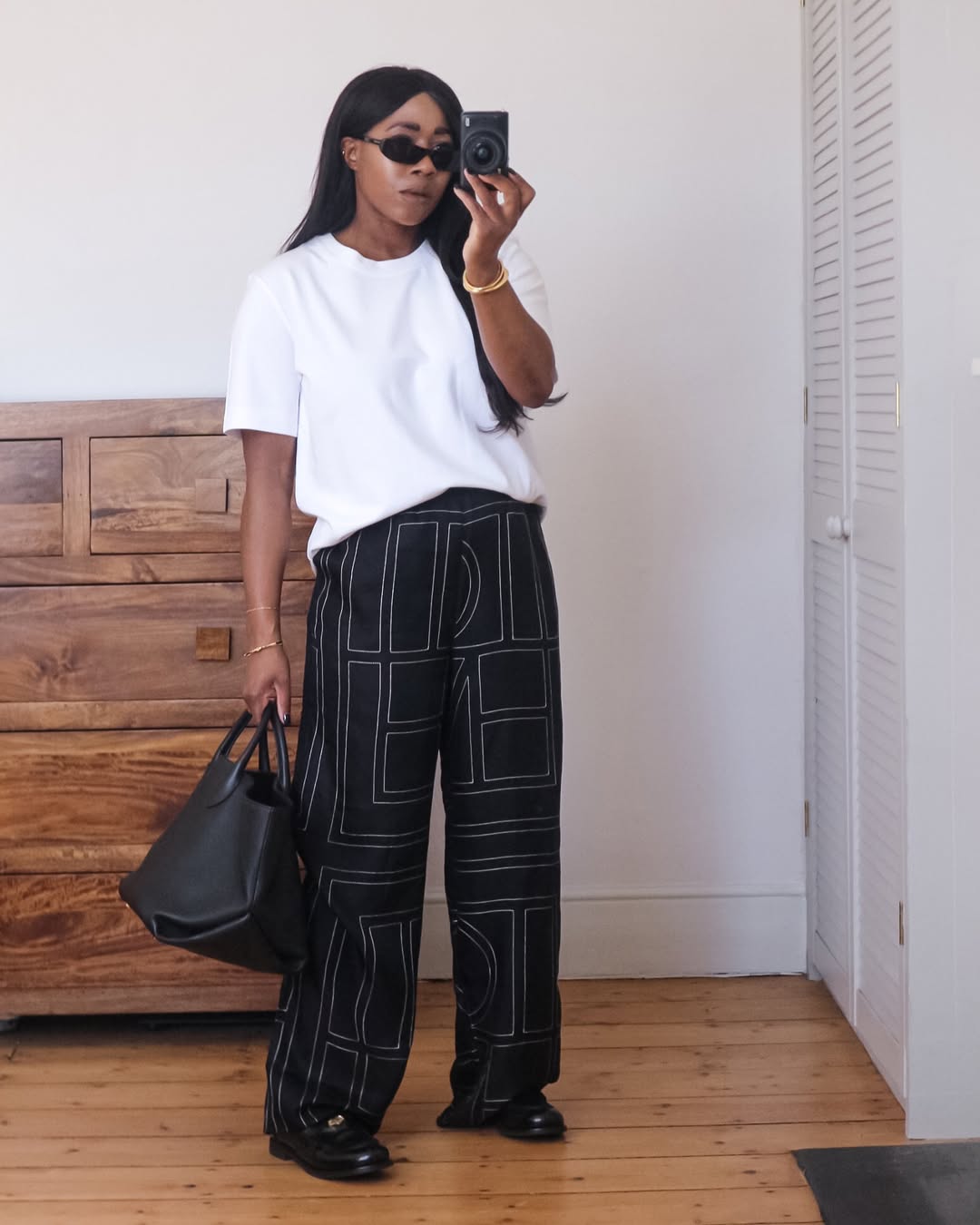@_loissterling wears silk trousers from Toteme
