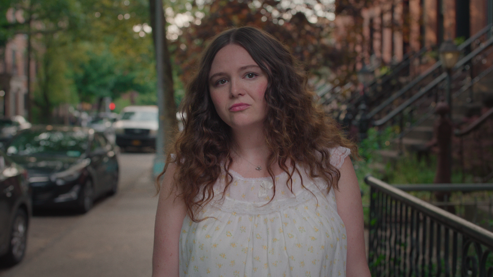 Jess from Too Much wears a nightgown on the streets of Brooklyn