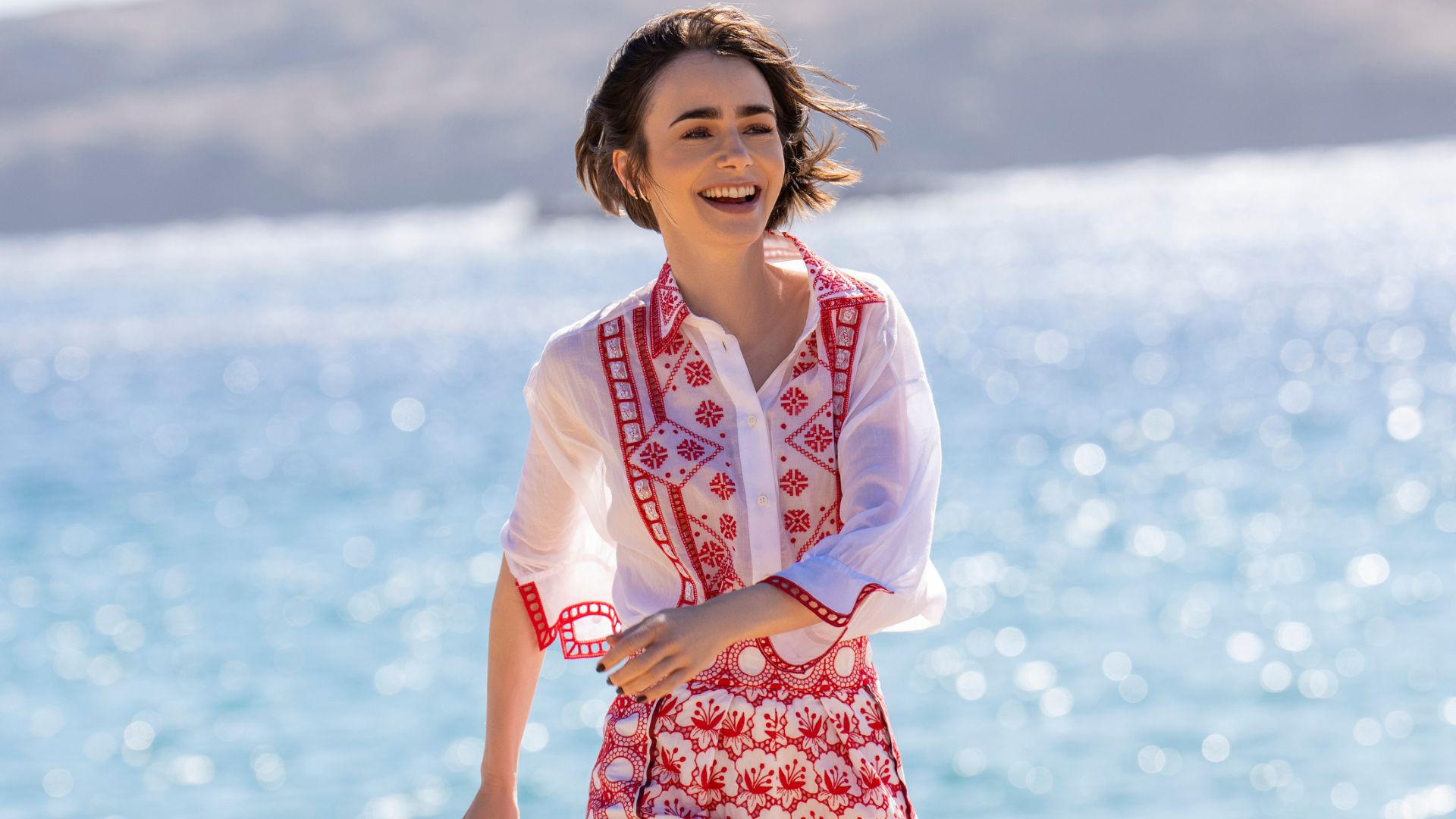 Emily laughs at the seaside