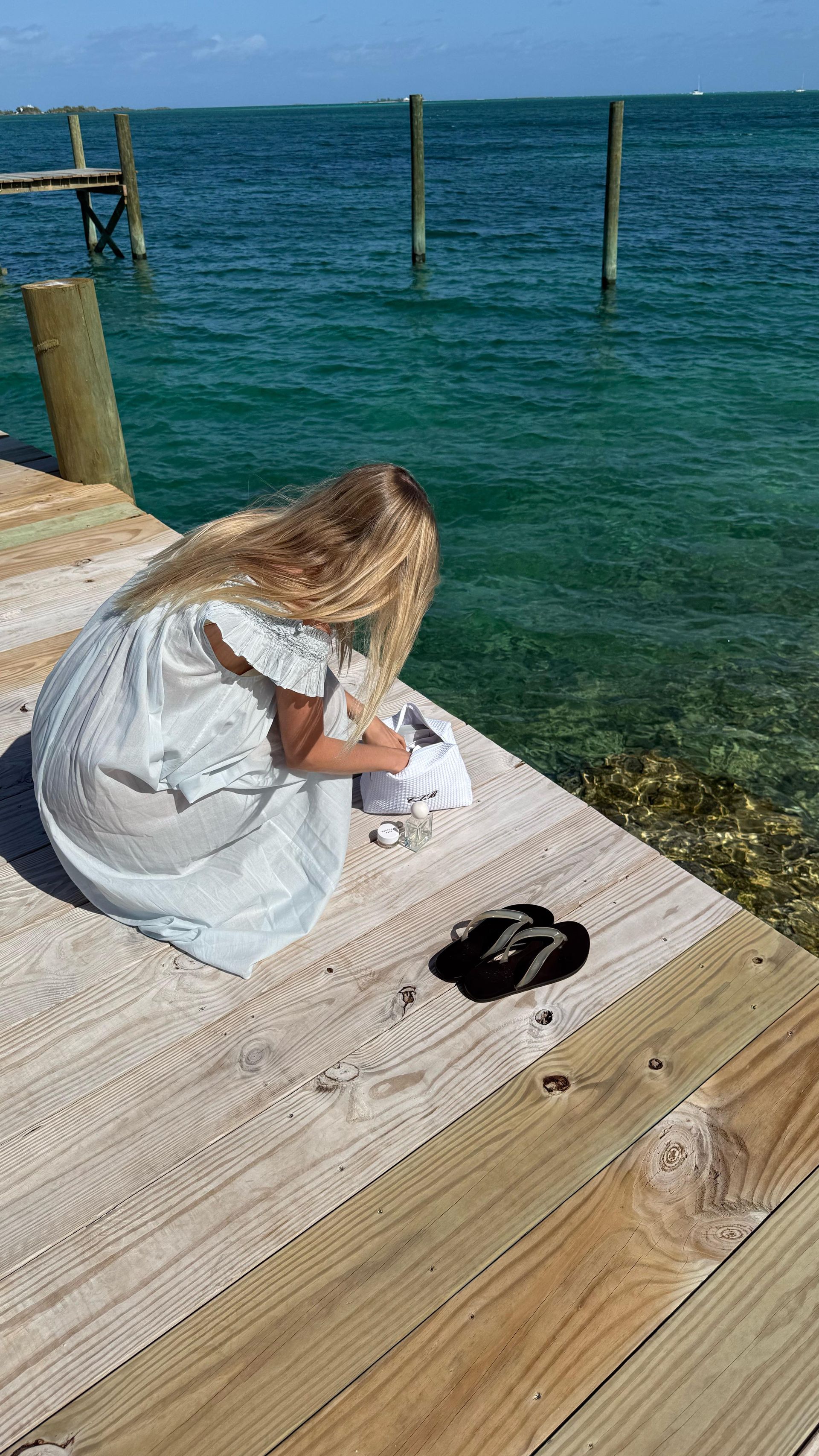An image of @caitlinburnhamm wearing jelly flip flops, one of the biggest summer accessories.