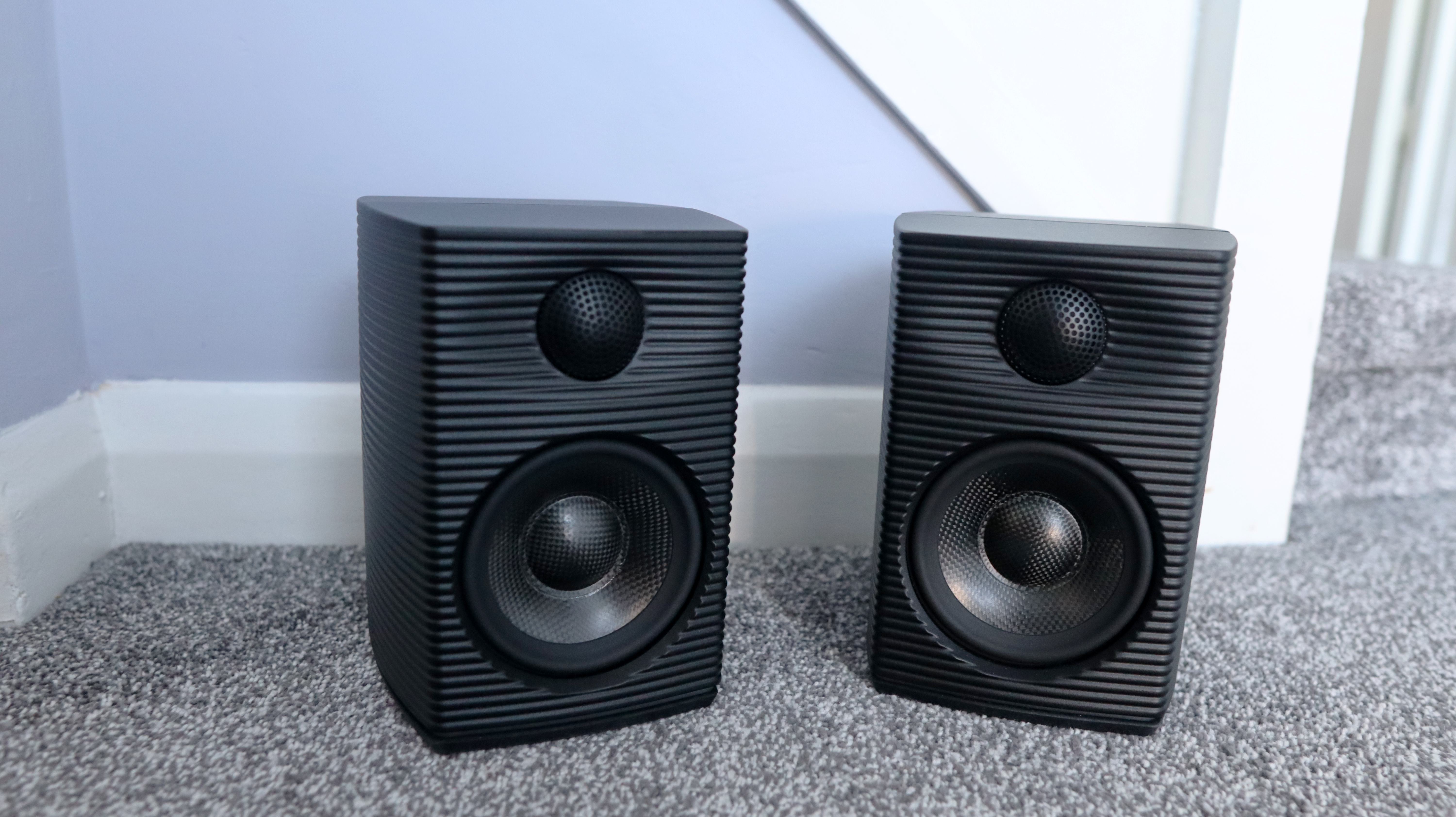 FiiO SP3 BT computer speakers set up on the floor.