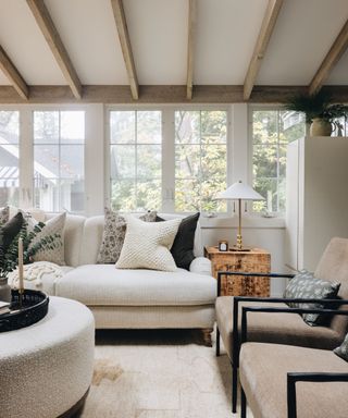 Leo cottage cozy sitting room with cream sofa, boucle coffee table and rug