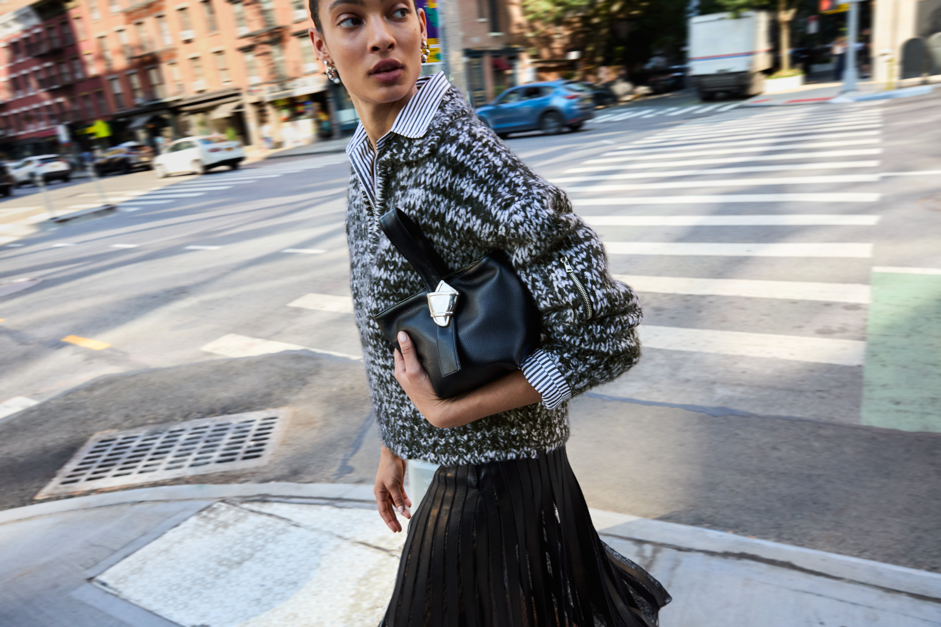 a model in new york carrying the merit x brandon maxwell bag