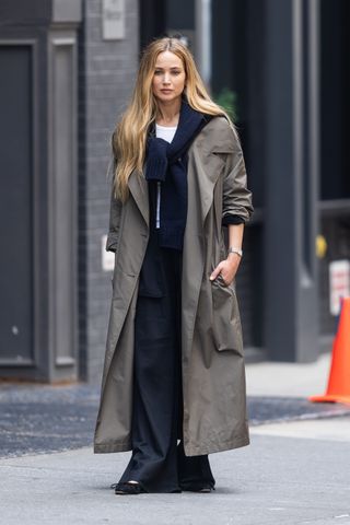 Celebrity autumn outfits: Jennifer Lawrence wears a trench coat with tailored trousers