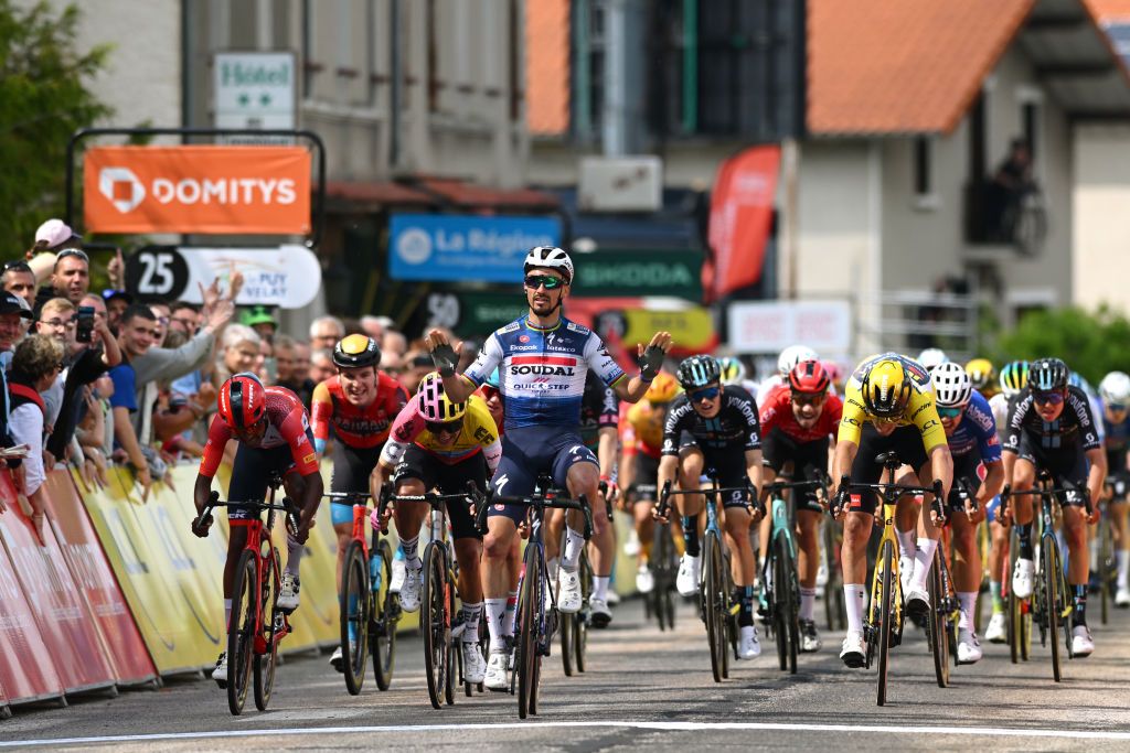 LA CHAISEDIEU FRANCE JUNE 05 Julian Alaphilippe of France and Team Soudal Quick Step celebrates at finish line as stage winner ahead of LR Natnael Tesfatsion of Eritrea and Team Trek Segafredo Richard Carapaz of Ecuador and Team EF EducationEasyPost and Christophe Laporte of France and Team JumboVisma Yellow Leader Jersey during the 75th Criterium du Dauphine 2023 Stage 2 a 1673km stage from BrassaclesMines to La ChaiseDieu 1080m UCIWT on June 05 2023 in La ChaiseDieu France Photo by Dario BelingheriGetty Images