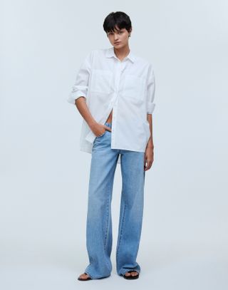 Madewell model in white poplin shirt and blue jeans