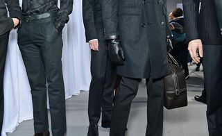 Male models with gloves and briefcase