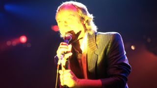 English drummer, singer, songwriter, and former member of the rock band Genesis, Phil Collins performs onstage at the Joe Louis Arena during the first show of the band's Invisible Touch Tour, on September 18, 1986, in Detroit, Michigan.