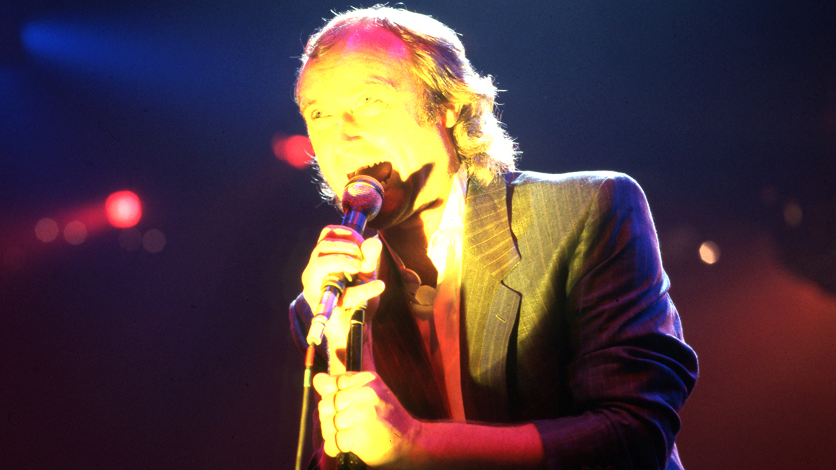 English drummer, singer, songwriter, and former member of the rock band Genesis, Phil Collins performs onstage at the Joe Louis Arena during the first show of the band's Invisible Touch Tour, on September 18, 1986, in Detroit, Michigan.